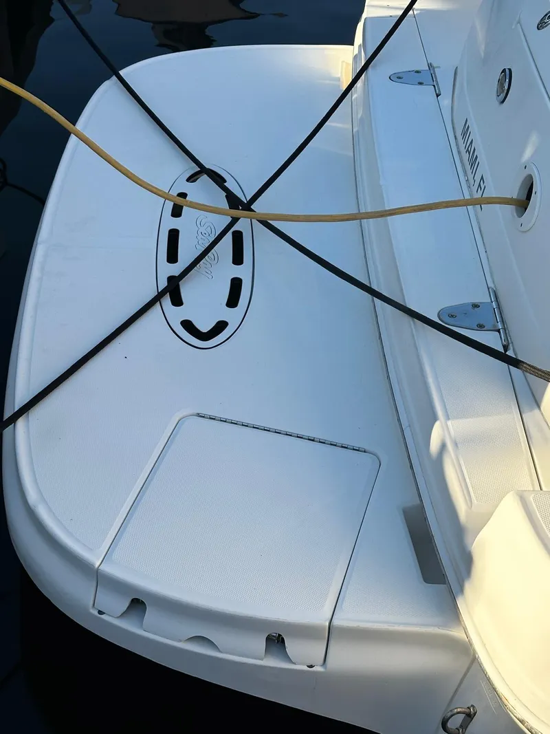 Slide: The Image of 2002 Sea Ray 320 Sundancer swim platform with mooring lines and water hose. - 4
