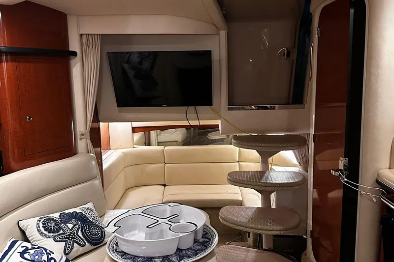 Slide: The Image of Luxurious interior of 2002 Sea Ray 320 Sundancer with cozy seating and modern amenities. - 6
