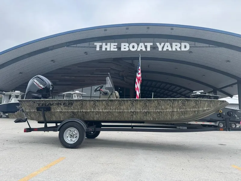 Slide: The Image of 2025 Tracker 1860 Grizzly boat at The Boat Yard dealership. - 4