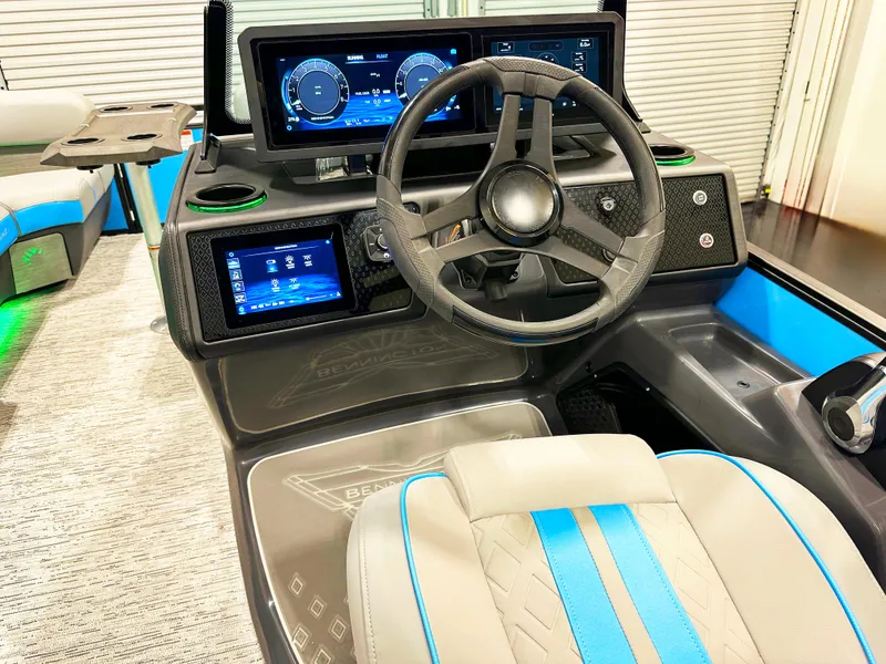 Slide: The Image of 2025 Bennington 22 MFBSE boat dashboard with modern controls and steering wheel. - 7