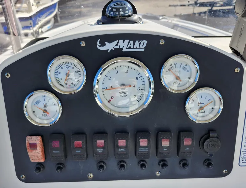 Slide: The Image of Dashboard of 2019 Mako 184 CC boat with gauges and switches. - 10
