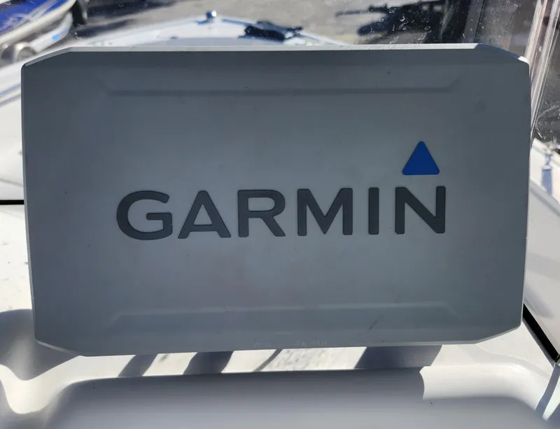Slide: The Image of Garmin device on 2019 Mako 184 CC boat dashboard in sunlight. - 11