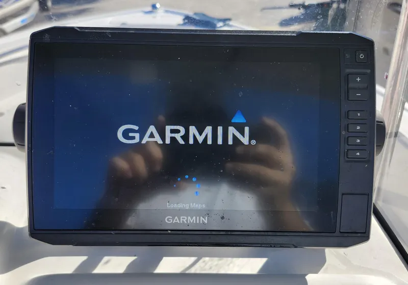Slide: The Image of Garmin GPS device on 2019 Mako 184 CC boat dashboard. - 13