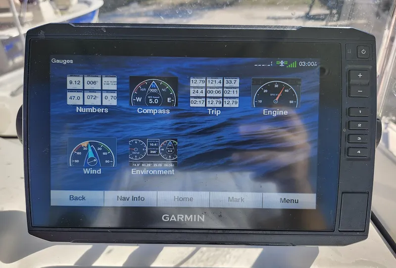 Slide: The Image of Garmin marine display showing gauges on a 2019 Mako 184 CC boat. - 14