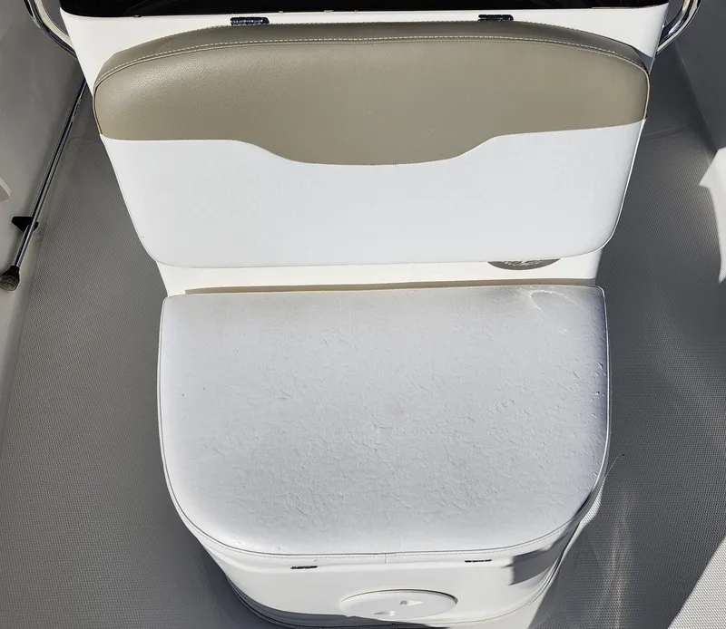 Slide: The Image of 2019 Mako 184 CC boat seat with white and beige upholstery. - 17