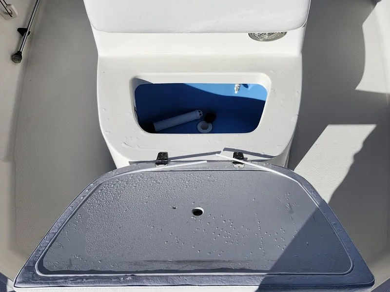 Slide: The Image of Open storage compartment on 2019 Mako 184 CC boat. - 18