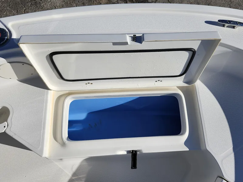 Slide: The Image of Open storage compartment on 2019 Mako 184 CC boat. - 20