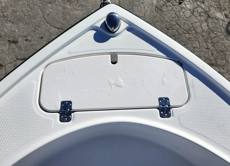 Slide: The Image of 2019 Mako 184 CC boat bow with storage compartment and cleat. - 23