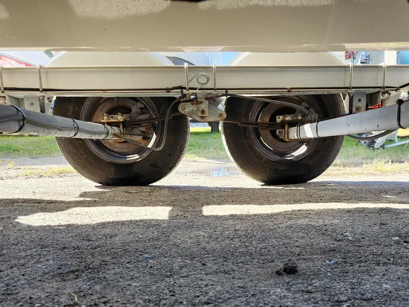 Slide: The Image of Underside view of 2019 Mako 184 CC trailer wheels on pavement. - 24