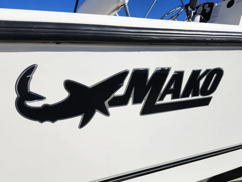 Slide: The Image of Mako 184 CC 2019 boat logo on white hull. - 29
