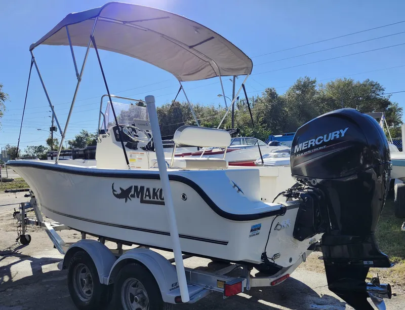 Slide: The Image of 2019 Mako 184 CC boat with Mercury outboard engine on trailer. - 4