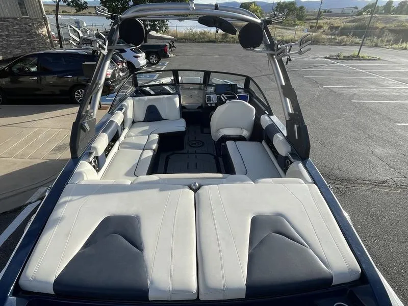 Slide: The Image of 2017 Malibu 21 VLX boat interior with spacious seating and sleek design. - 14