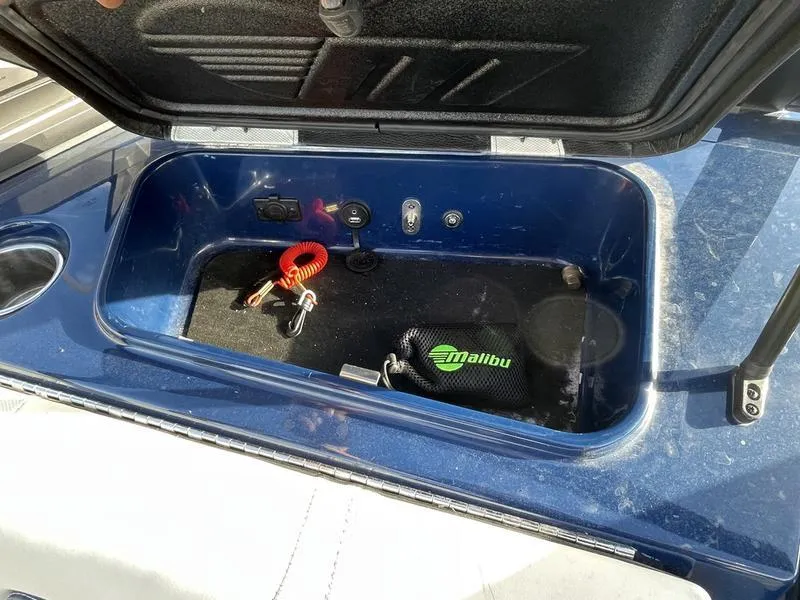 Slide: The Image of Open storage compartment in a 2017 Malibu 21 VLX boat. - 29