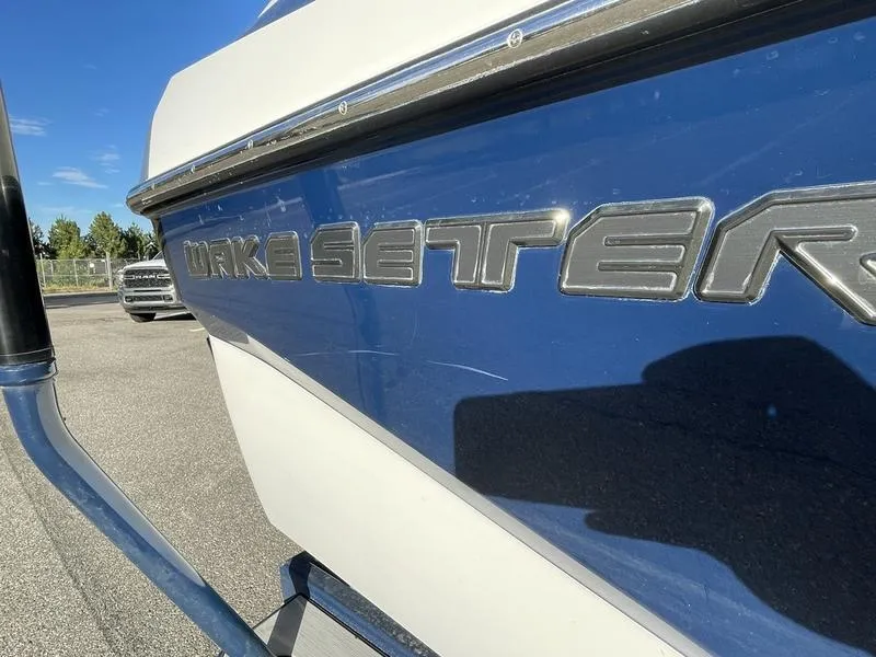 Slide: The Image of Close-up of 2017 Malibu 21 VLX Wakesetter boat in blue and white. - 35