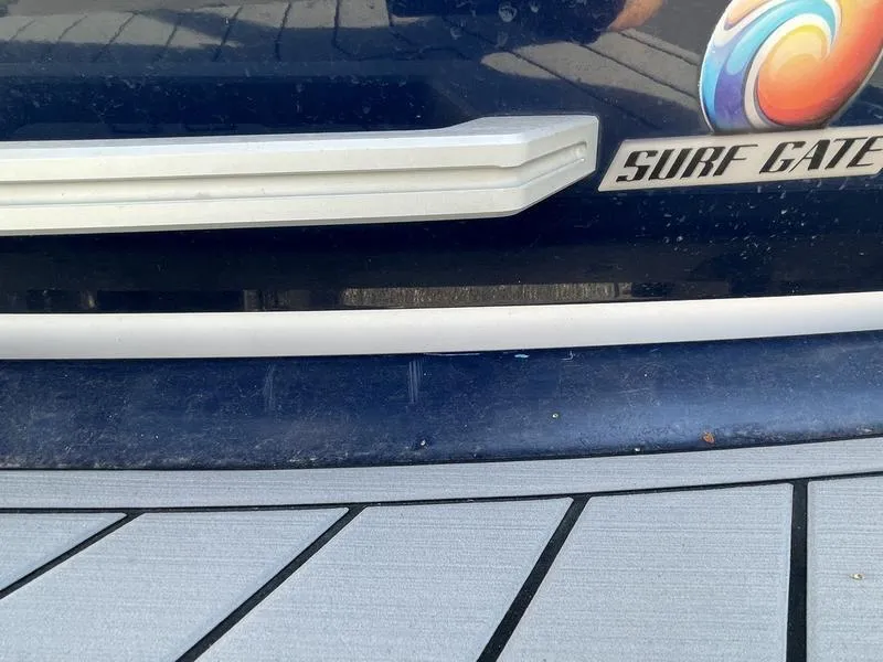 Slide: The Image of 2017 Malibu 21 VLX boat with Surf Gate feature, close-up view. - 41