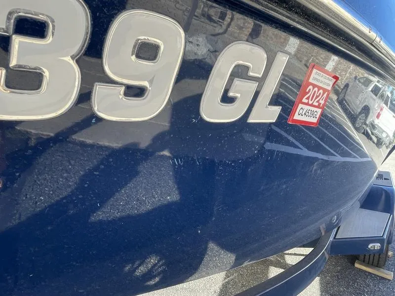 Slide: The Image of Close-up of a 2017 Malibu 21 VLX boat with 2024 registration sticker. - 45