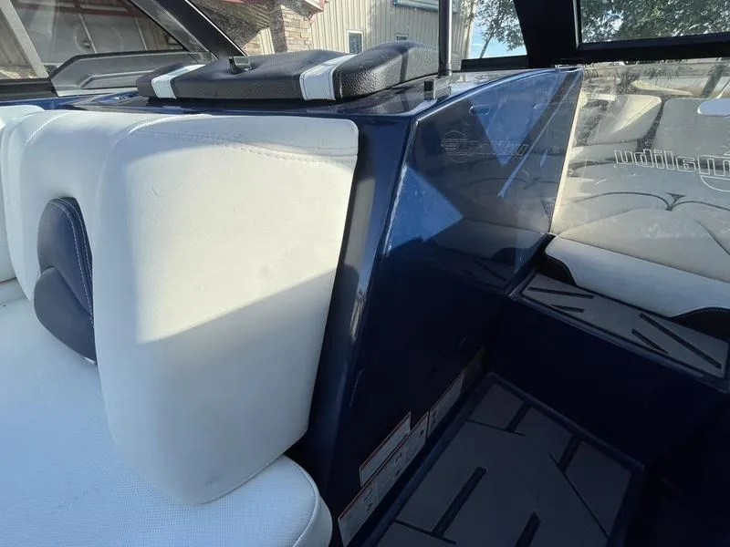 Slide: The Image of 2017 Malibu 21 VLX interior with white and blue seating, modern design. - 48