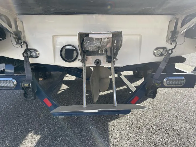 Slide: The Image of 2017 Malibu 21 VLX boat stern with propeller and trailer. - 9