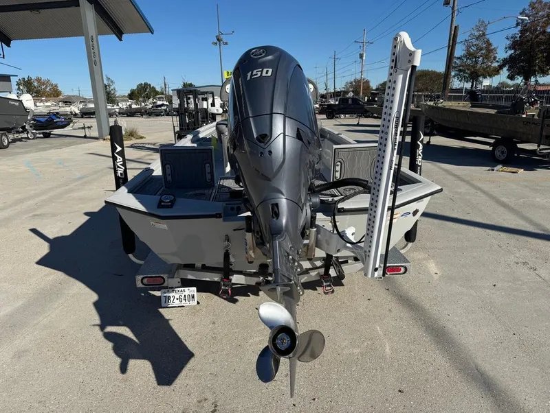 Slide: The Image of 2024 Avid 21 FS Platinum boat with Yamaha 150 outboard motor in a dealership lot. - 11