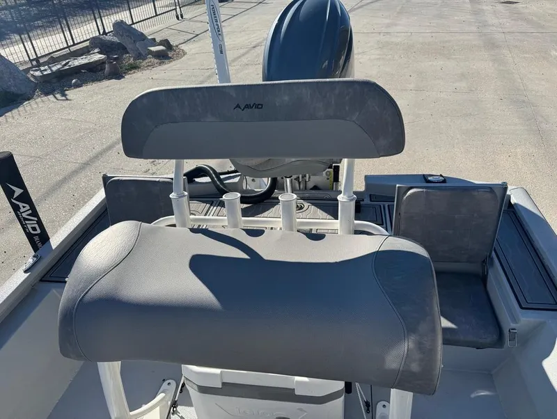 Slide: The Image of 2024 Avid 21 FS Platinum boat interior with seating and rod holders. - 14