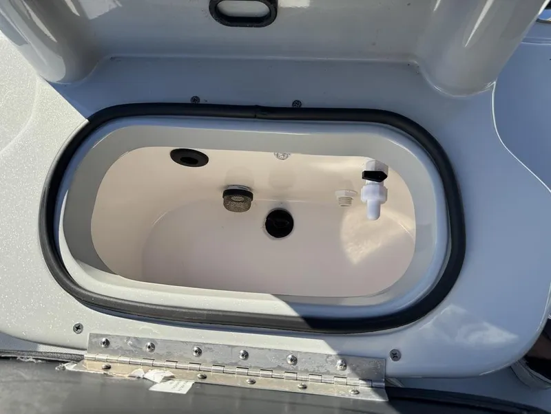 Slide: The Image of 2024 Avid 21 FS Platinum boat livewell interior view. - 18