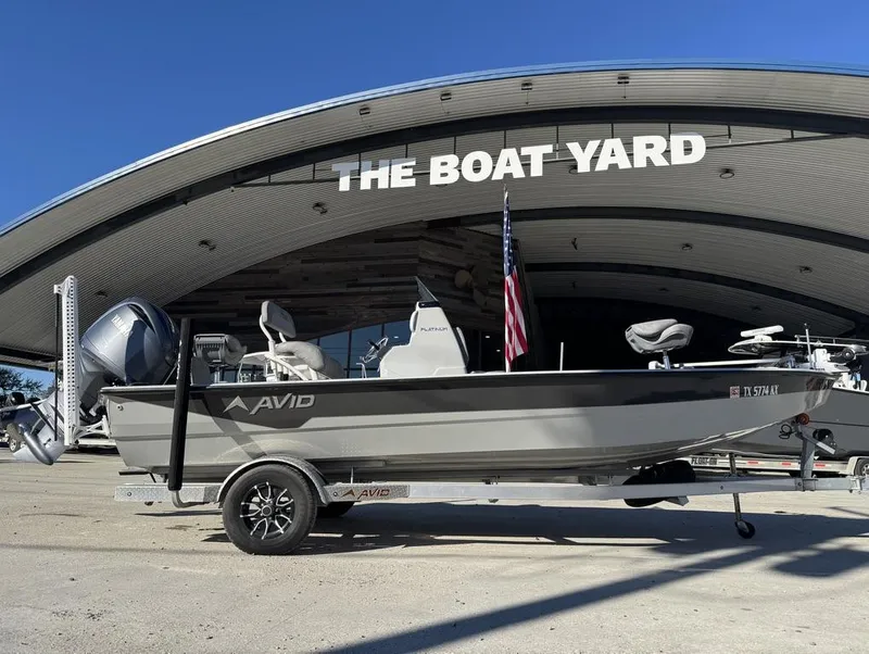 Slide: The Image of 2024 Avid 21 FS Platinum boat at The Boat Yard dealership. - 2