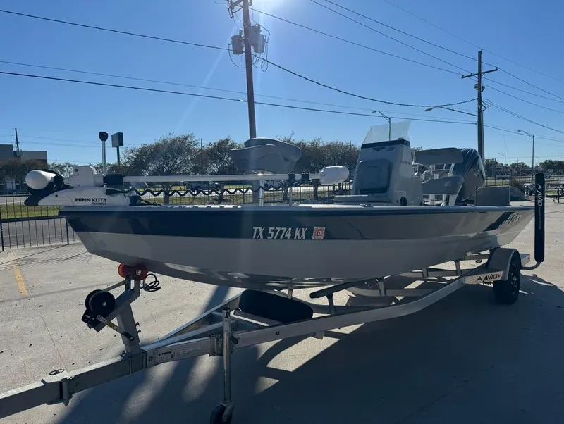 Slide: The Image of 2024 Avid 21 FS Platinum boat on trailer, sunny day, outdoor setting. - 5