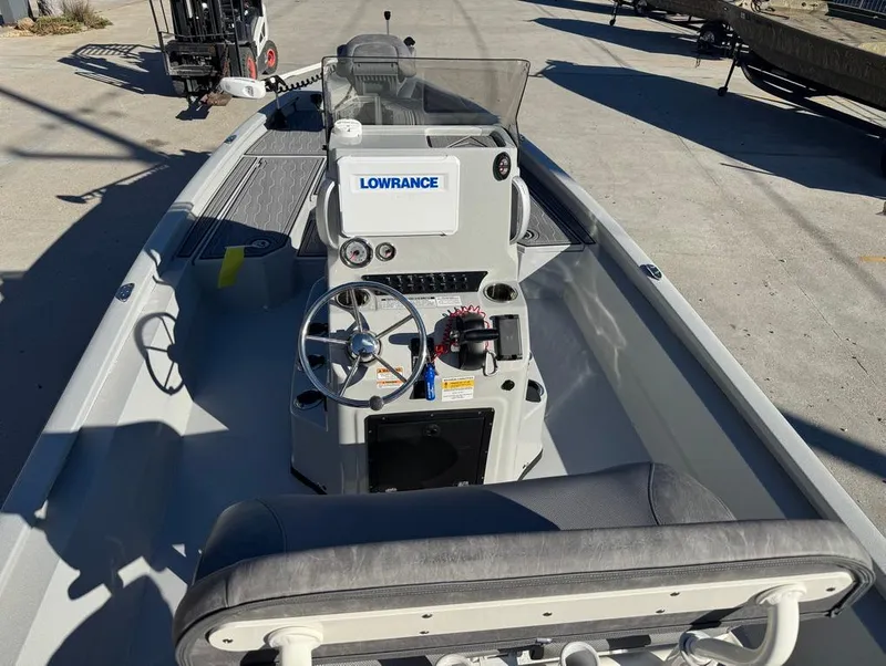 Slide: The Image of 2024 Avid 21 FS Platinum boat interior with steering console and Lowrance equipment. - 7