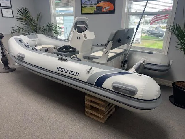 Slide: The Image of 2025 Highfield Classic 340 inflatable boat displayed indoors. - 2