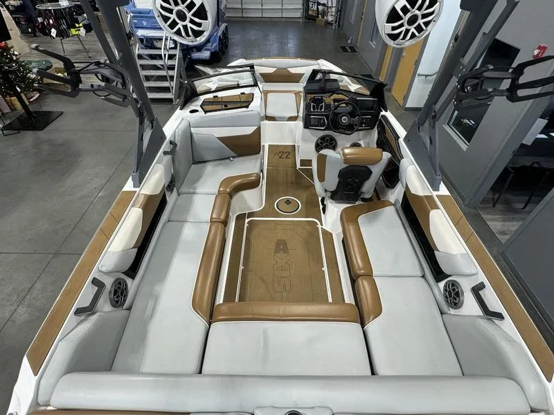 Slide: The Image of 2022 Axis A22 boat interior with modern seating and audio system. - 5