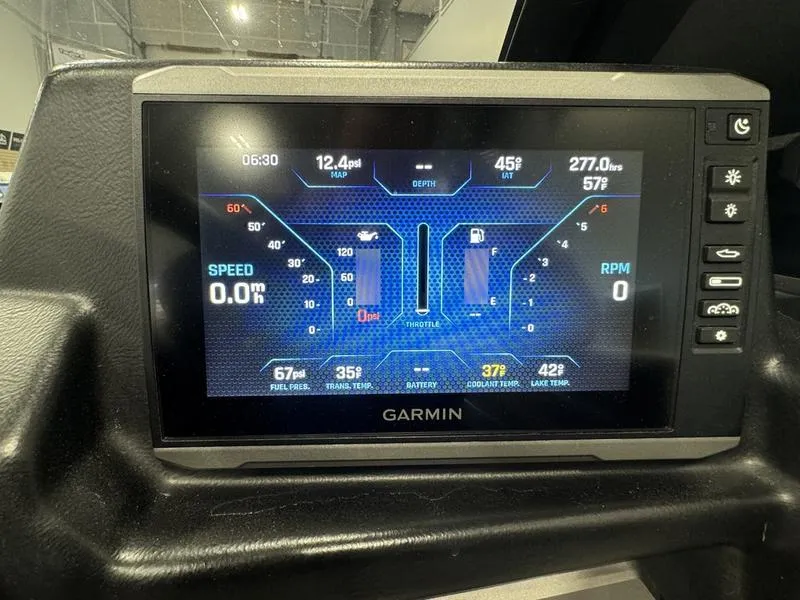 Slide: The Image of Garmin display in 2022 Axis A22 boat showing speed, RPM, and fuel levels. - 7