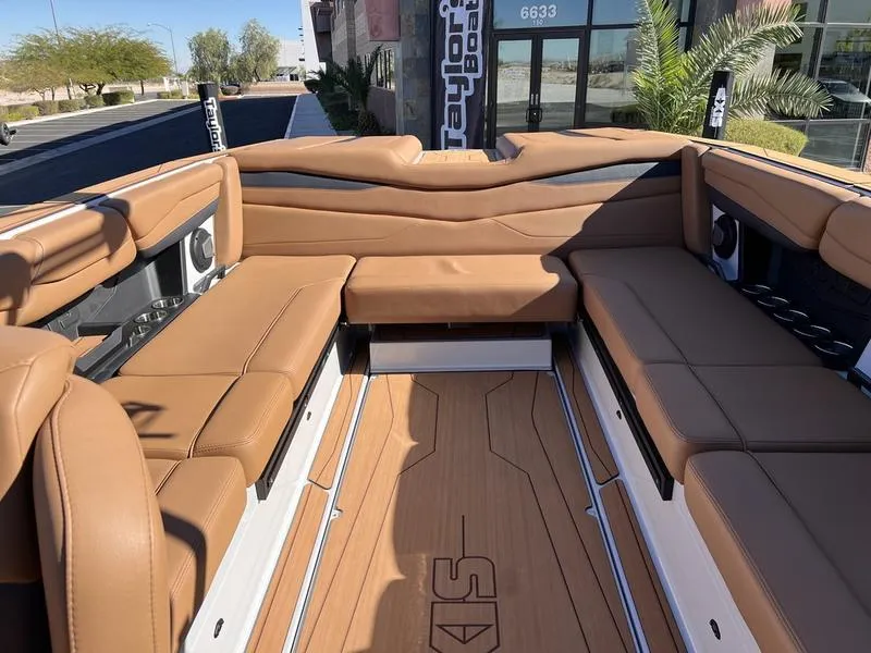 Slide: The Image of Luxurious interior of 2025 Axis A245 boat with tan leather seating and sleek design. - 17