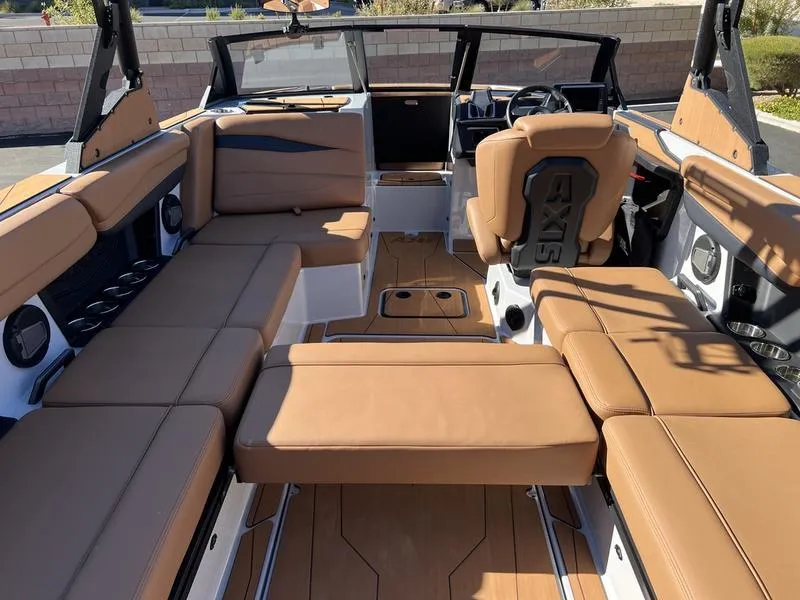 Slide: The Image of Luxurious interior of 2025 Axis A245 boat with tan leather seating. - 19