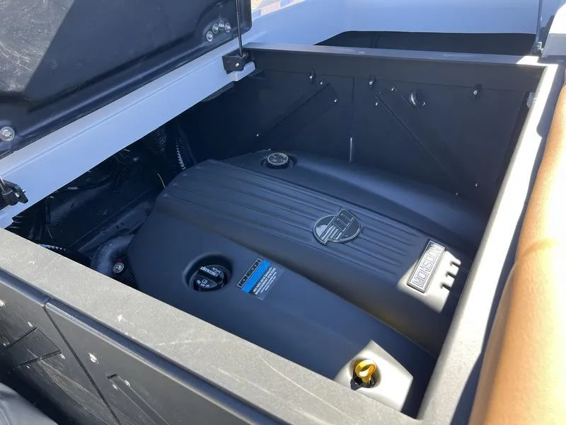 Slide: The Image of 2025 Axis A245 engine compartment with visible engine cover. - 2