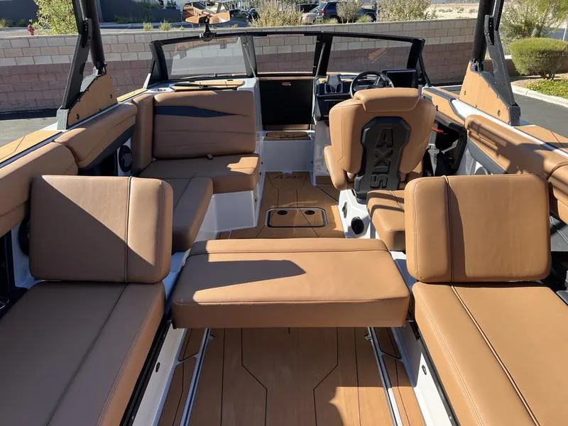 Slide: The Image of 2025 Axis A245 boat interior with tan leather seating and modern design. - 20