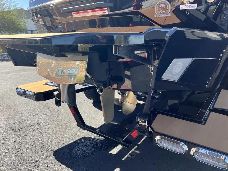 Slide: The Image of 2025 Axis A245 boat stern with propeller and swim platform in sunlight. - 22