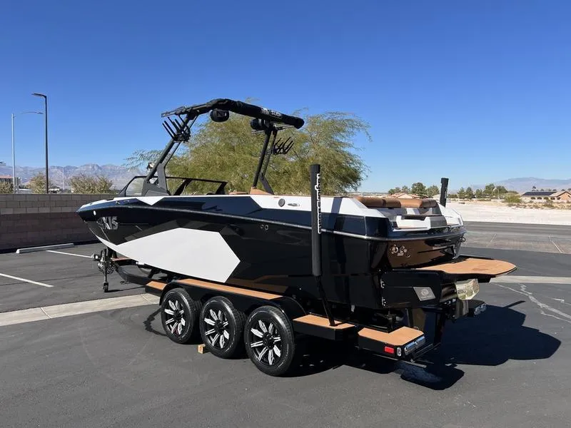 Slide: The Image of 2025 Axis A245 boat on trailer in sunny parking lot. - 3