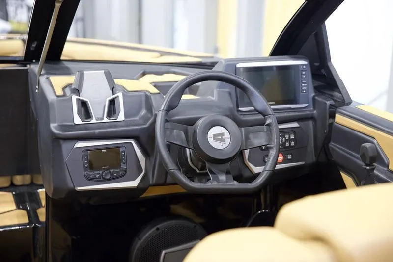 Slide: The Image of 2025 Axis T235 boat dashboard with modern steering wheel and digital displays. - 12