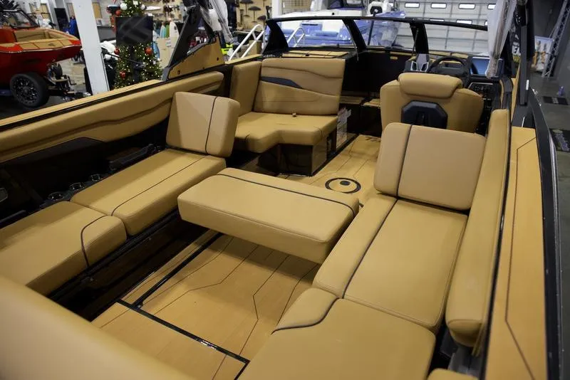 Slide: The Image of Luxurious interior of 2025 Axis T235 boat with tan seating and modern design. - 15