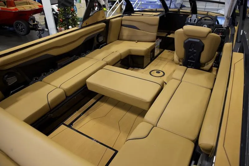 Slide: The Image of Luxurious interior of 2025 Axis T235 boat with tan leather seating and modern design. - 16