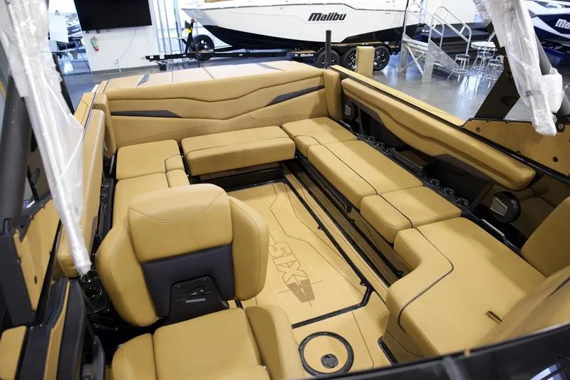 Slide: The Image of Luxurious interior of 2025 Axis T235 boat with tan seating and modern design. - 18