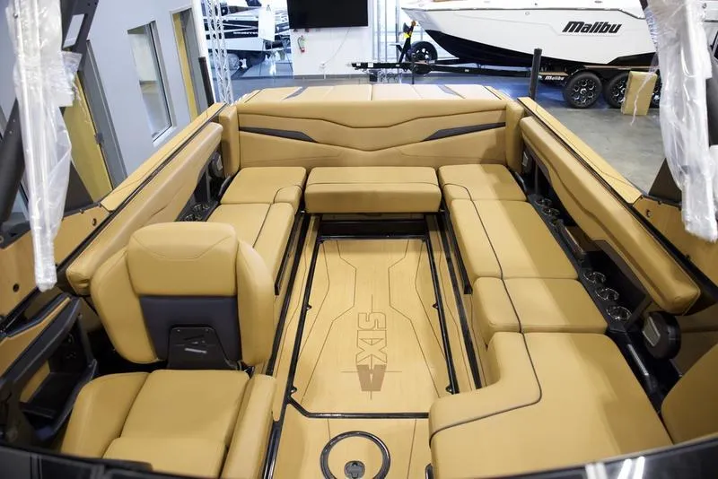 Slide: The Image of Luxurious interior of 2025 Axis T235 boat with tan seating and sleek design. - 19