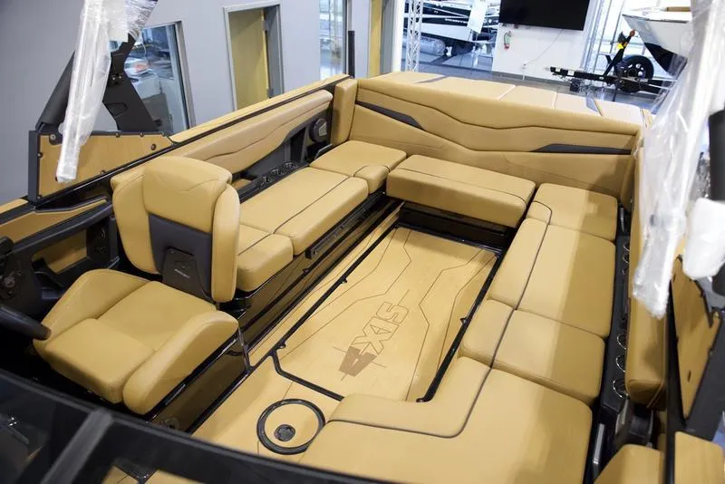 Slide: The Image of Luxurious interior of 2025 Axis T235 boat with tan seating and spacious layout. - 20
