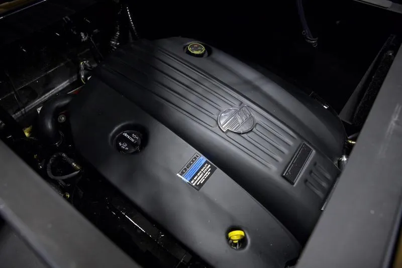 Slide: The Image of 2025 Axis T235 engine close-up, showcasing sleek black design and branding details. - 3