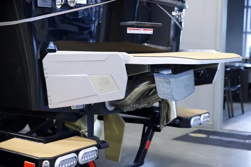 Slide: The Image of 2025 Axis T235 boat rear view with swim platform and exhaust system. - 5