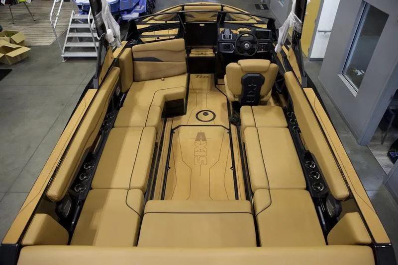 Slide: The Image of Luxurious interior of 2025 Axis T235 boat with tan seating and modern design. - 9