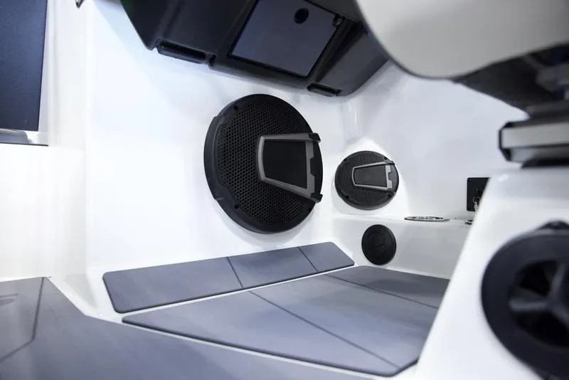 Slide: The Image of Interior of 2025 Axis A245 boat with modern speaker system and seating. - 13