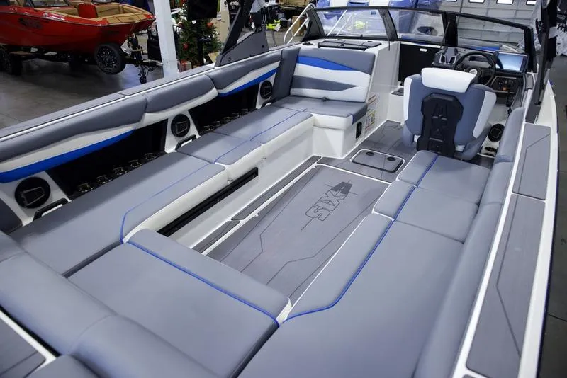 Slide: The Image of 2025 Axis A245 boat interior with gray and blue seating, modern design. - 16