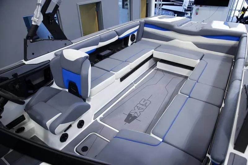 Slide: The Image of 2025 Axis A245 boat interior with gray and blue seating, modern design. - 20
