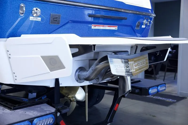 Slide: The Image of 2025 Axis A245 boat rear view with Power Wedge III and propeller details. - 5